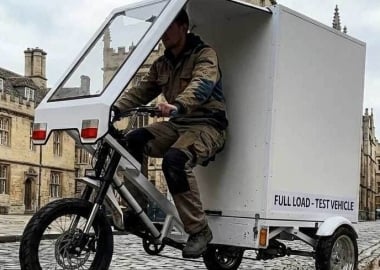 stress testing a heavy duty cargo trike driving over cobblestones and curbs